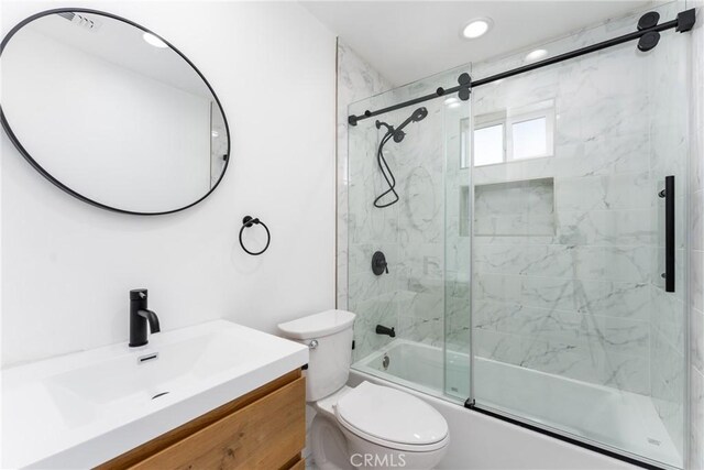 full bath with toilet, enclosed tub / shower combo, vanity, and recessed lighting