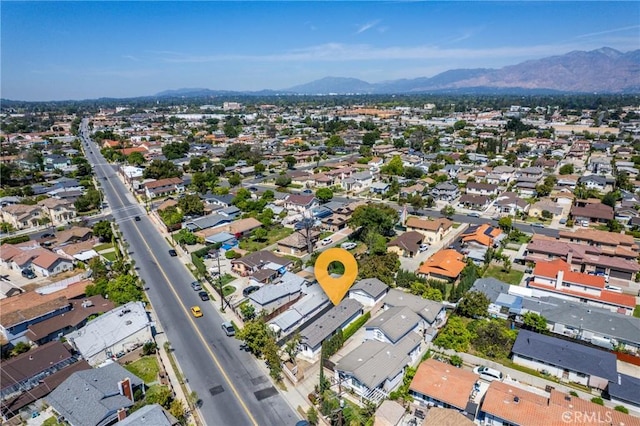 view of property location with a mountainous background and nearby suburban area