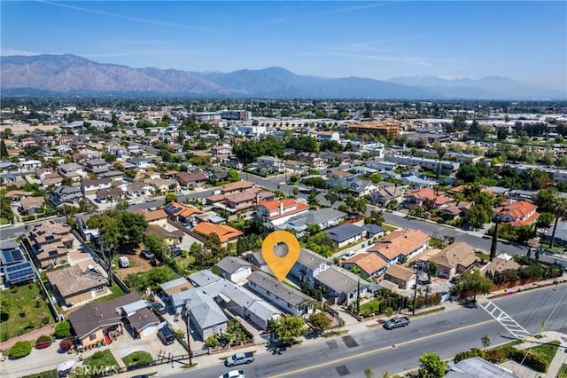aerial view of residential area with mountains