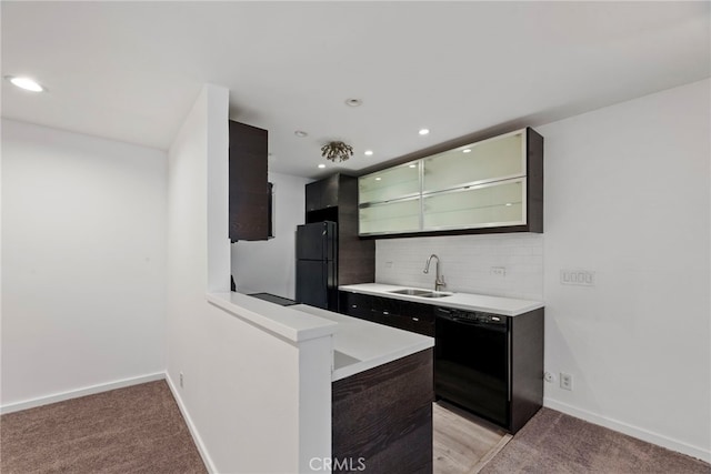 525 N Sycamore Ave Unit 333, Los Angeles, CA 90036 - kitchen featuring black appliances, light countertops, tasteful backsplash, recessed lighting, and light colored carpet
