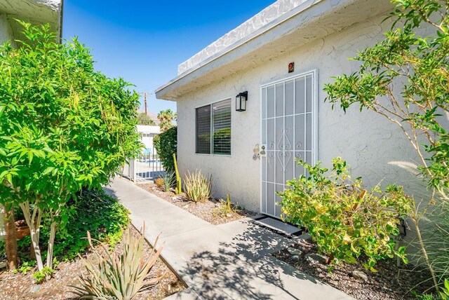 800 E Cottonwood Rd Unit 2, Palm Springs, CA 92262 - doorway to property with stucco siding