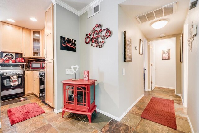 800 E Cottonwood Rd Unit 2, Palm Springs, CA 92262 - corridor featuring light stone finish floors, baseboards, and crown molding
