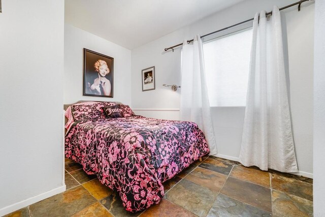 800 E Cottonwood Rd Unit 2, Palm Springs, CA 92262 - bedroom featuring stone tile floors