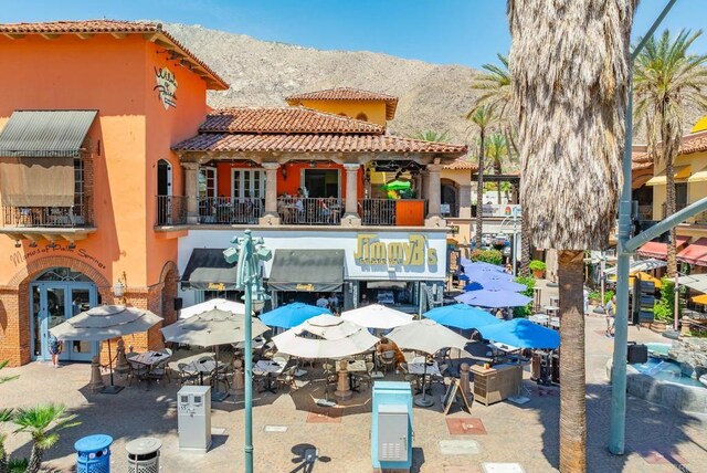 800 E Cottonwood Rd Unit 2, Palm Springs, CA 92262 - back of property with a mountain view, stucco siding, and a tiled roof