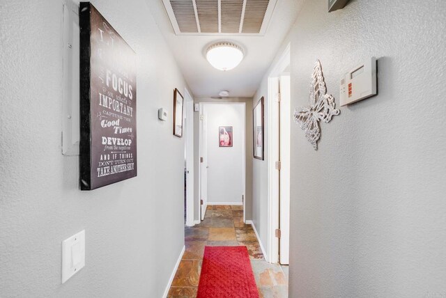 800 E Cottonwood Rd Unit 2, Palm Springs, CA 92262 - hallway featuring baseboards and stone finish floors