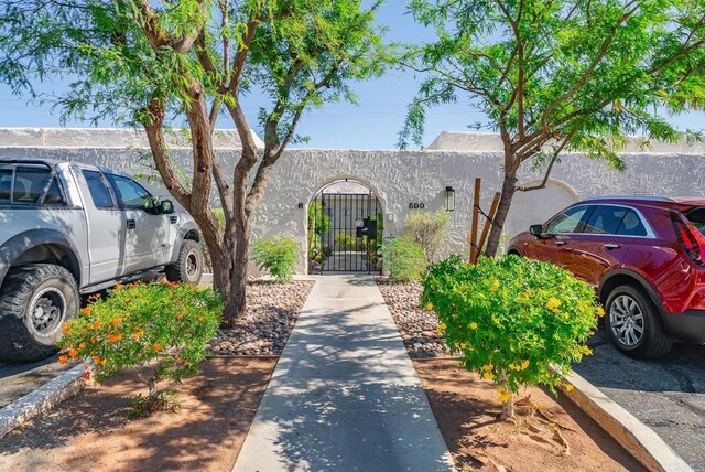 800 E Cottonwood Rd Unit 2, Palm Springs, CA 92262 - townhome / multi-family property with stucco siding and a gate