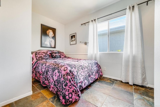 800 E Cottonwood Rd Unit 2, Palm Springs, CA 92262 - bedroom featuring stone finish floors and baseboards