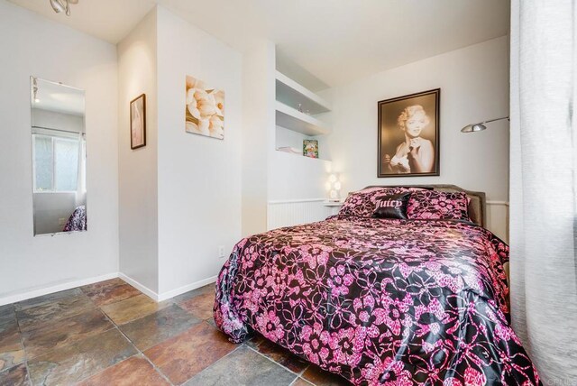 800 E Cottonwood Rd Unit 2, Palm Springs, CA 92262 - bedroom featuring stone finish floors and baseboards