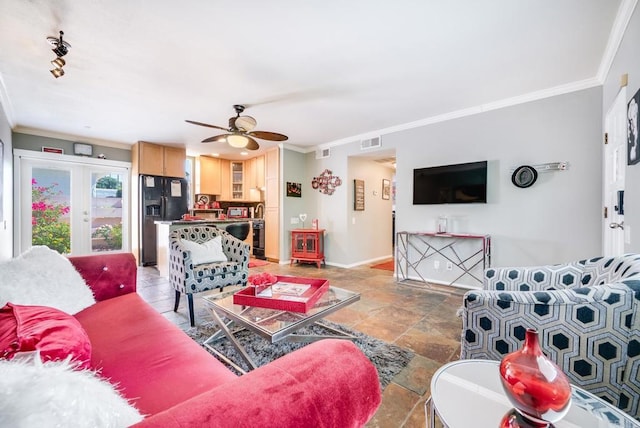 800 E Cottonwood Rd Unit 2, Palm Springs, CA 92262 - living area featuring crown molding, ceiling fan, light stone finish flooring, french doors, and baseboards