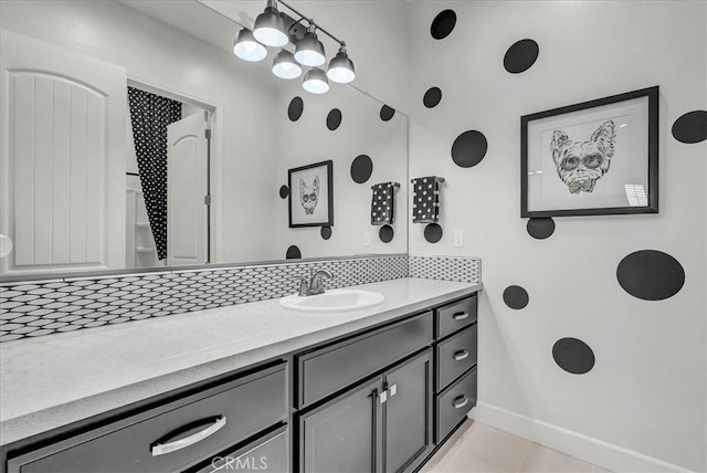 2219 W Malone St, Hanford, CA 93230 - bathroom with baseboards, vanity, and tile patterned flooring