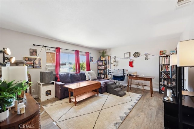 10616 Jamul Rd, Apple Valley, CA 92308 - living room featuring light wood finished floors and visible vents
