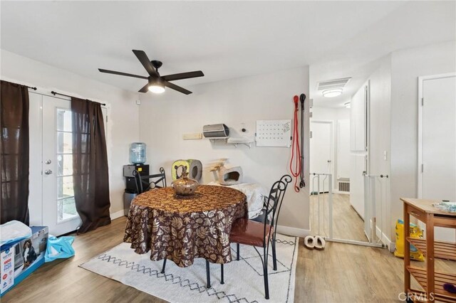 10616 Jamul Rd, Apple Valley, CA 92308 - dining area with light wood-style flooring, visible vents, a ceiling fan, and baseboards