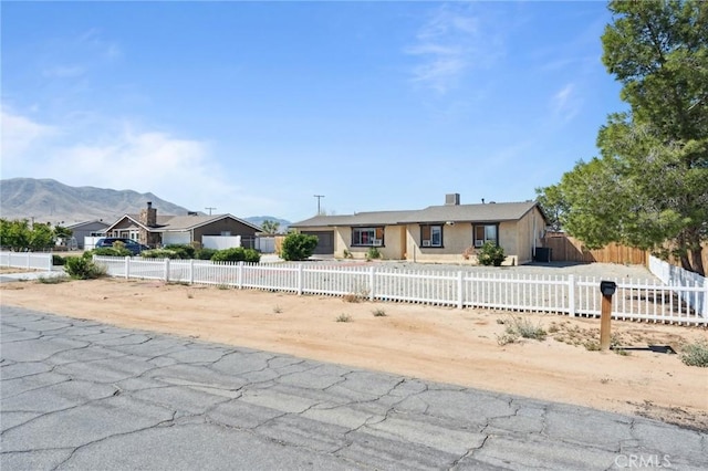10616 Jamul Rd, Apple Valley, CA 92308 - ranch-style home with a mountain view and a fenced front yard