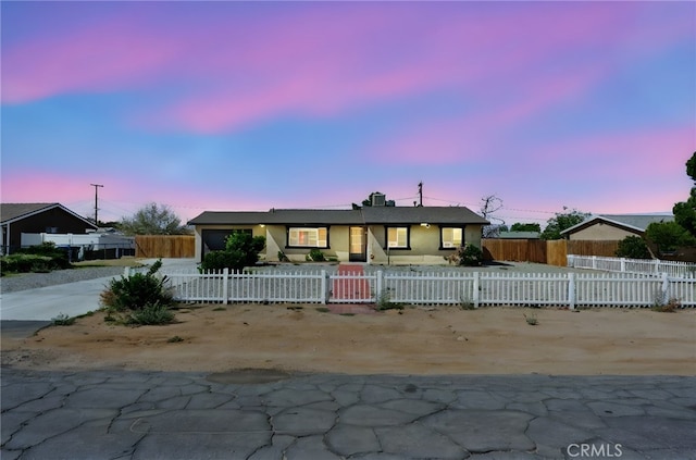 10616 Jamul Rd, Apple Valley, CA 92308 - view of front facade with stucco siding, concrete driveway, and a fenced front yard