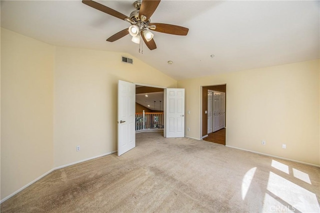 6356 Claridge Dr, Riverside, CA 92506 - unfurnished bedroom with visible vents, light carpet, baseboards, ceiling fan, and vaulted ceiling