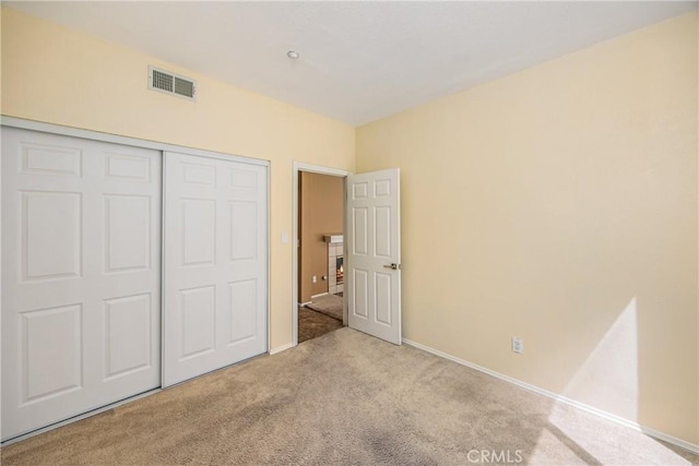 6356 Claridge Dr, Riverside, CA 92506 - unfurnished bedroom featuring a closet, baseboards, carpet flooring, and visible vents