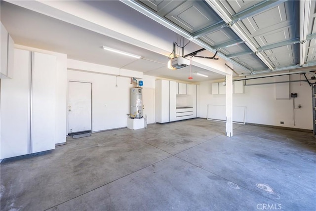 6356 Claridge Dr, Riverside, CA 92506 - garage featuring a garage door opener and water heater