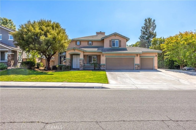6356 Claridge Dr, Riverside, CA 92506 - traditional-style home with a garage, a front lawn, concrete driveway, stone siding, and stucco siding