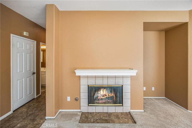 6356 Claridge Dr, Riverside, CA 92506 - unfurnished living room with a tiled fireplace, baseboards, and carpet flooring