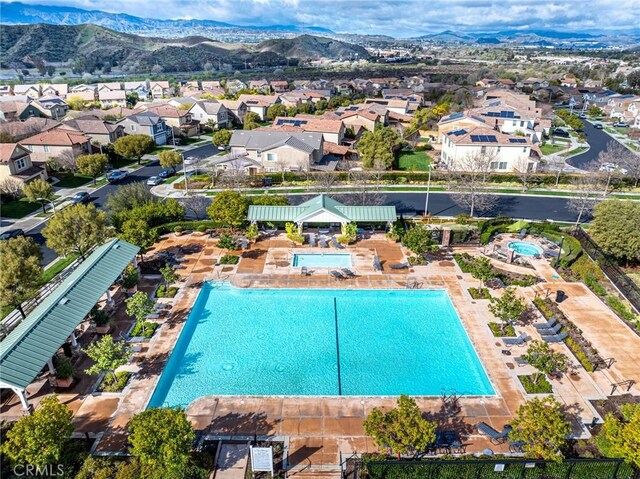 22514 Brightwood Pl, Saugus, CA 91350 - aerial view of residential area featuring a pool area and a mountainous background