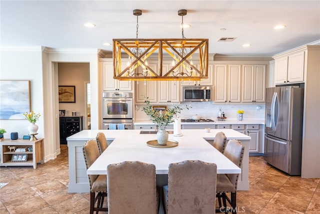 dining room featuring recessed lighting, visible vents, and crown molding