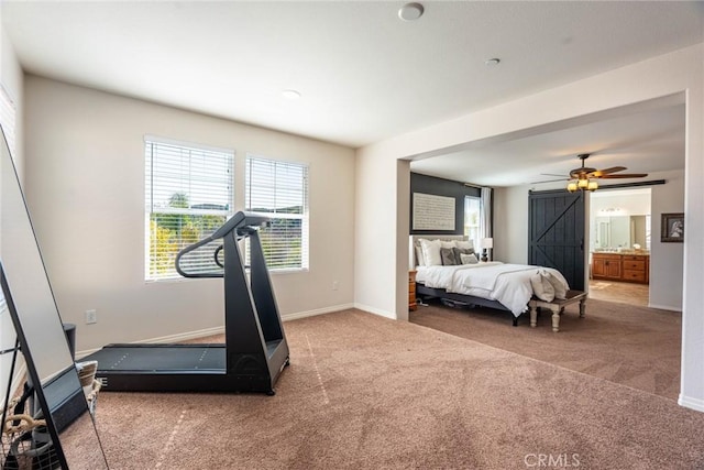 workout area with ceiling fan, baseboards, and carpet flooring
