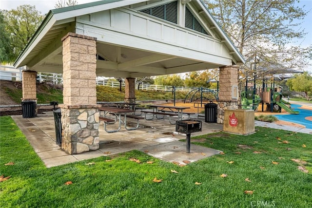view of home's community with playground community, a lawn, and a gazebo