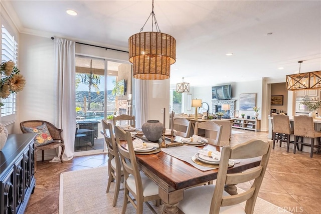 dining area with light tile patterned flooring, a chandelier, and plenty of natural light