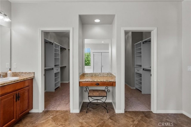 22514 Brightwood Pl, Saugus, CA 91350 - full bathroom with a walk in closet, vanity, a shower stall, and tile patterned floors