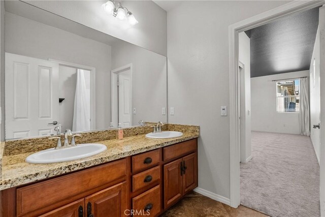 22514 Brightwood Pl, Saugus, CA 91350 - full bathroom featuring double vanity and baseboards