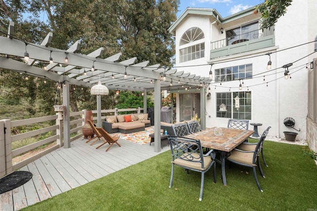 wooden terrace with a pergola, a lawn, and outdoor lounge area