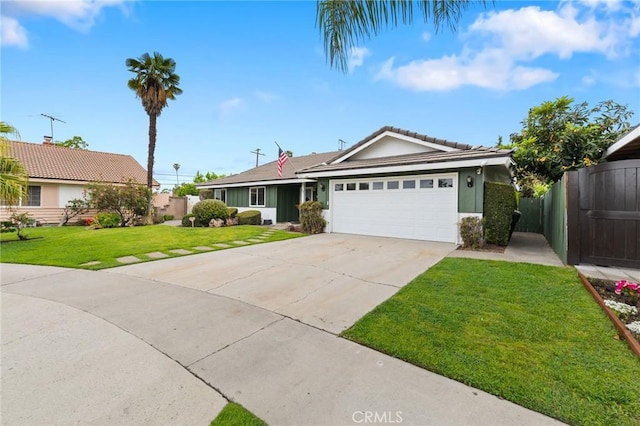 ranch-style house featuring fence, a front lawn, stucco siding, driveway, and a garage