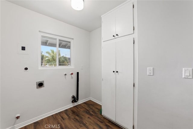 washroom featuring baseboards, dark wood finished floors, hookup for an electric dryer, and cabinet space