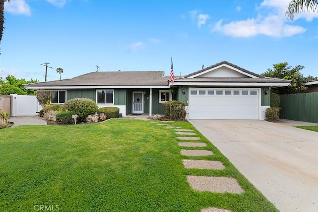 ranch-style home featuring a front lawn, a tiled roof, driveway, fence, and a garage