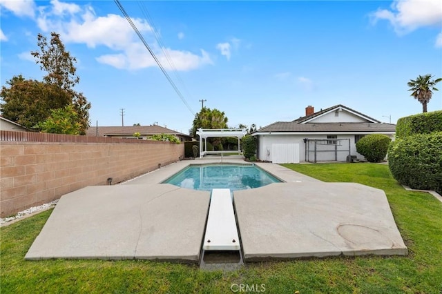view of pool featuring a lawn, a fenced backyard, a fenced in pool, and a patio area