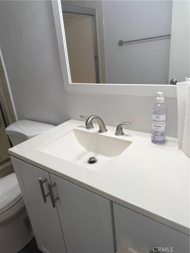 4727 W 147th St Unit 116, Lawndale, CA 90260 - bathroom featuring toilet, vanity, and a shower