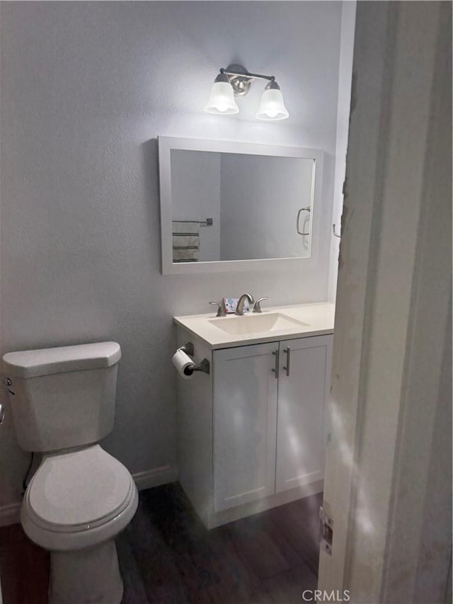 4727 W 147th St Unit 116, Lawndale, CA 90260 - bathroom featuring vanity, toilet, wood finished floors, and baseboards