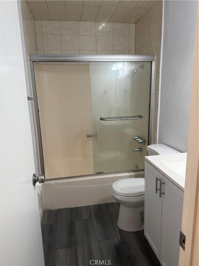 4727 W 147th St Unit 116, Lawndale, CA 90260 - full bath with vanity, toilet, combined bath / shower with glass door, and wood finished floors