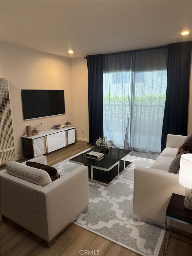 4727 W 147th St Unit 116, Lawndale, CA 90260 - living area with wood finished floors, a heating unit, recessed lighting, and baseboards