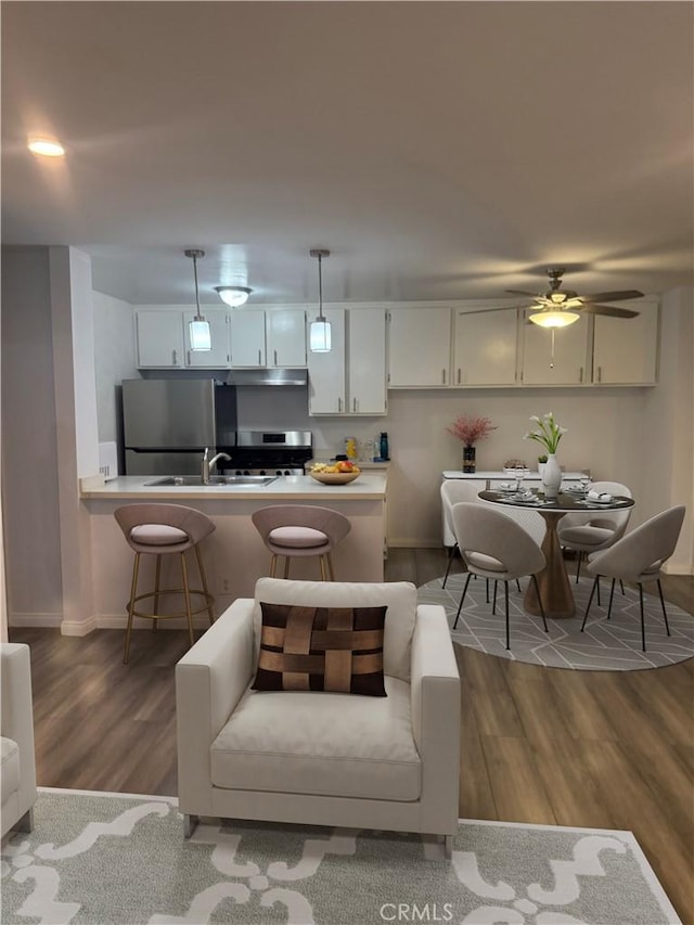 4727 W 147th St Unit 116, Lawndale, CA 90260 - living area with wood finished floors, baseboards, and a ceiling fan