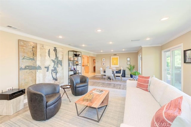 living area with light wood-type flooring, visible vents, and recessed lighting