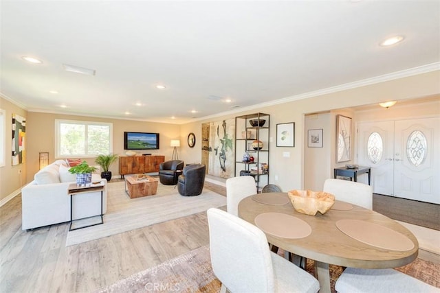 dining area with crown molding, wood finished floors, and recessed lighting