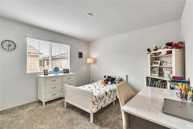 carpeted bedroom featuring baseboards