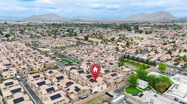 birds eye view of property featuring a mountain view