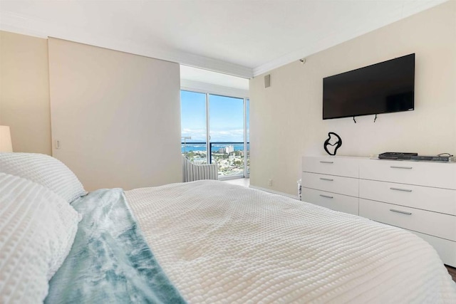 bedroom with baseboards and access to outside