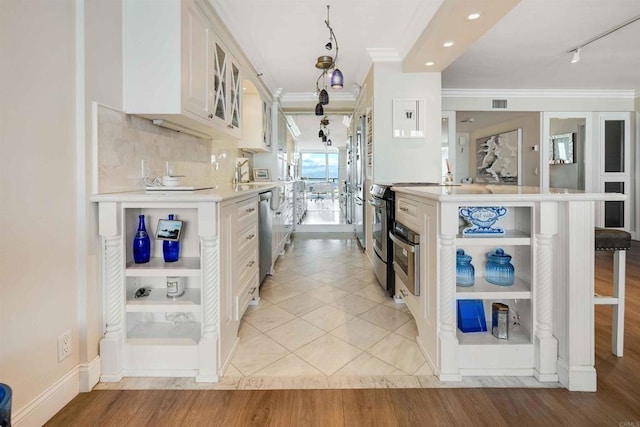 kitchen with open shelves, light countertops, appliances with stainless steel finishes, and ornamental molding
