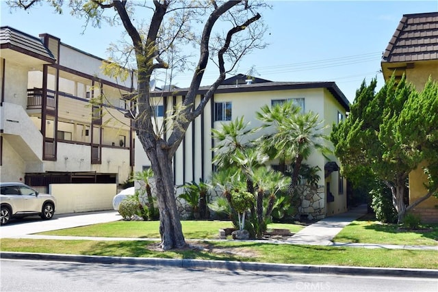 341 N Isabel St, Glendale, CA 91206 - view of front of house featuring a tile roof and stucco siding