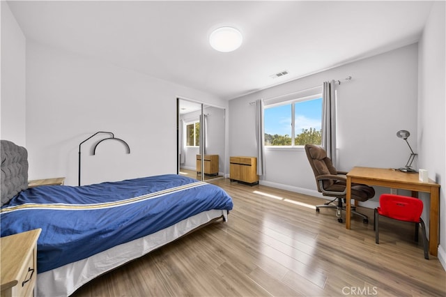 24288 Highcrest Dr, Diamond Bar, CA 91765 - bedroom with baseboards, a closet, visible vents, and light wood-type flooring