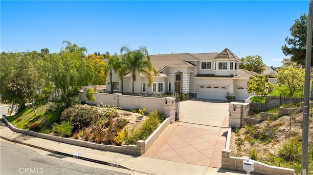 24288 Highcrest Dr, Diamond Bar, CA 91765 - view of front facade with a tiled roof, driveway, fence, an attached garage, and stucco siding
