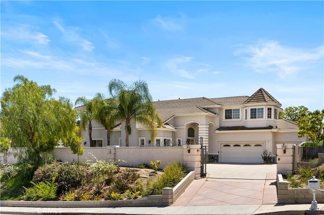 24288 Highcrest Dr, Diamond Bar, CA 91765 - view of front of home with a fenced front yard, concrete driveway, a tiled roof, an attached garage, and stucco siding